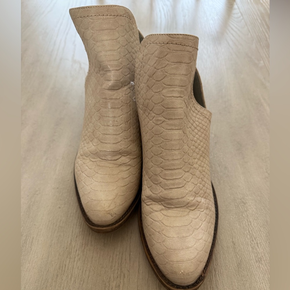 Volatile cream snakeskin booties